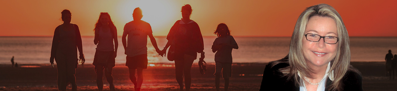 Profile photo of Valerie Hemhauser with a sunset beach background, featuring people walking along the shore.